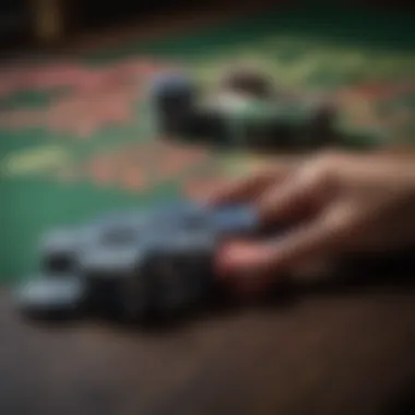 A close-up of poker chips and cards on a table.